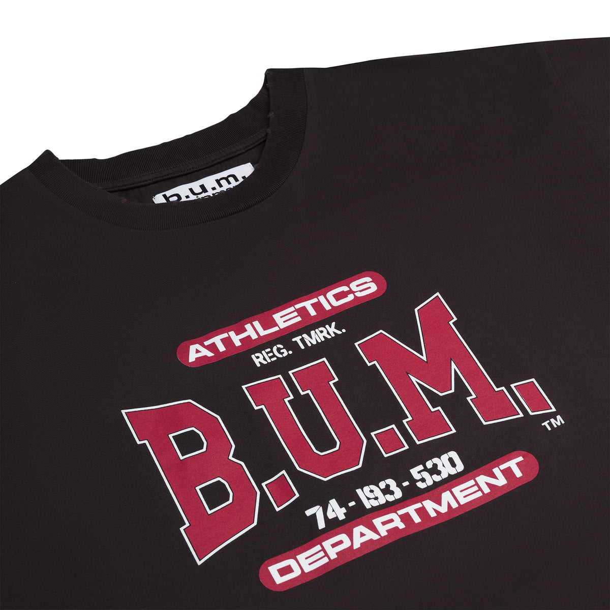 Back of the B.U.M. Equipment black T-shirt, with the large arched red and white B.U.M. EQUIPMENT print