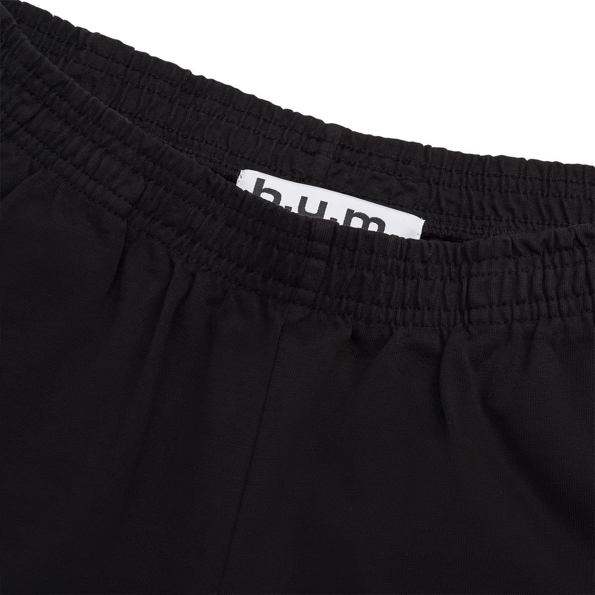 Detail of the womens B.U.M. Equipment black shorts, showing the elastic waistband