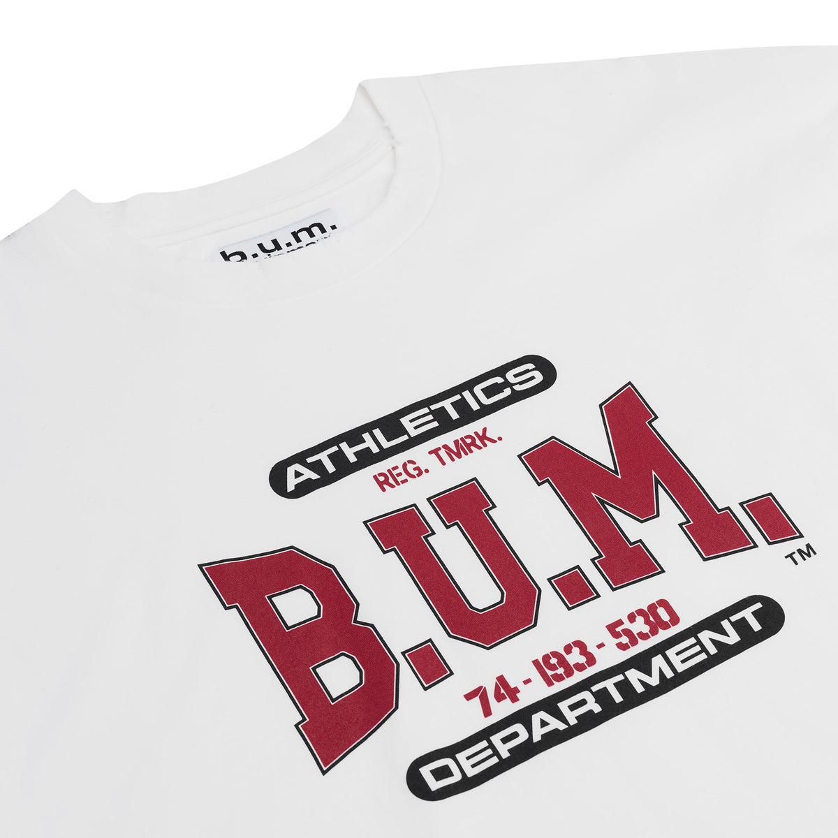 Back of the B.U.M. Equipment white T-shirt, with the large arched red B.U.M. EQUIPMENT print